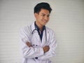 TheÃ¢â¬â¹ YoungÃ¢â¬â¹ medicalÃ¢â¬â¹ doctorÃ¢â¬â¹ standingÃ¢â¬â¹ in front of the clinicÃ¢â¬â¹ HealthcareÃ¢â¬â¹ University Hospital